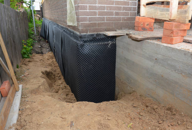 Happy homeowners after waterproofing job in Luckey